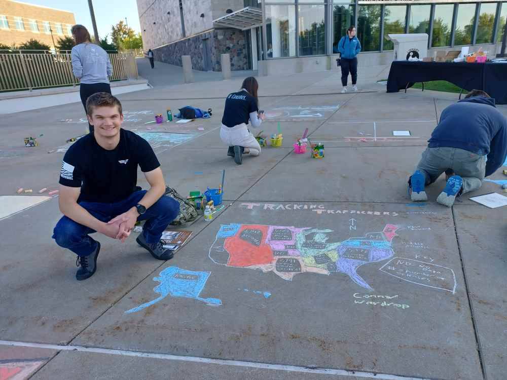 Psychology major Connor Wardrop presents at GVSU Chalk Art Symposium